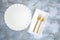 White plate gold cutlery