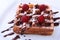 White plate with homemade belgian waffles with Sifting sugar powder over black background.