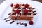 White plate with homemade belgian waffles with Sifting sugar powder over black background.