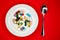 White plate with pills and spoon