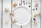 White plate with seashells on white wooding background, wallpaper top view