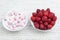 White plate with strawberries and white plate with strawberry marshmallow