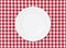 White plate on tablecloth