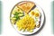 white plate with toast with avocado and scrambled eggs sprinkled with herbs and peers