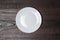 White plate on wooden brown table