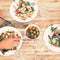 White plates of salad, olives, champagne on table