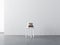 White Plywood chair with stack of books mockup in empty room