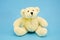 White polar bear toy on azure background