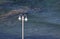 White pole with lights on sea background