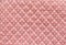 White Polka dot over pink fabric table texture background