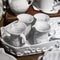 White porcelain jugs in a white tray as decoration for the kitchen