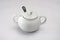 White porcelain sugar bowl with lid and spoon.