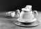 White porcelain tea cup and teapot, Afternoon tea table setting Black & White