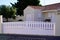 White portal suburb pvc plastic modern gate white fence on home suburb street access door house garden