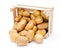 White potatoes in wooden crate