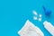 White powder, diaper on a blue background, flatley, top view, copy space, mock up. Baby hygiene, background for newborn boys