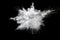 White powder explosion on black background.Stopping the movement of white powder on dark background.