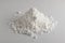 White Powder of Gypsum, Clay or Diatomite on Grey Background
