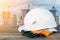 White protective helmet against the background of standing buildings. The concept of Safety and health of a worker, builder, engin