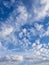 White, puffy clouds in blue sky