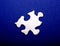 White Puzzle Piece on Blue