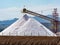 White pyramids with natural sea salt, salt works on factory near