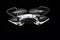 White quadcopter flying dark background