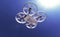 White quadrocopter drone in the sunny sky, high quality render