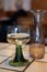 White quality riesling wine served in green swirl wine glass in old German restaurant in Monschau village, Germany