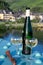 White quality riesling wine served on old bridge across Mosel river with view on old German town in sunny day