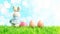 White rabbit doll with colorful Easter eggs on green grass. Spring holidays concept