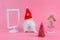 White rabbit with red christmas hat and chrismas tree and white picture frame, copy space for text.