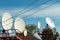 A white radio telecommunications satellite dishes