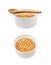 White ramekin filled with corn kernels