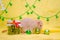 White rat dumbo sits near New Year jar on yellow background with a Christmas tree, bells, sniffing balls symbol of 2020
