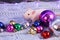 White rat with multicolored christmas balls, symbol of the new year 2020