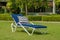 White rattan sun lounger in the garden