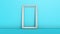 White rectangular picture frame on floor lean against pastel blue wall