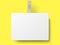 White rectangular self adhesive supermarket shelf paper wobbler with transparent strip, price banner or label isolated on yellow