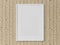 White rectangular vertical frame hanging on a wooden wall mockup 3D rendering