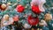 White and red balls as decoration for New Years celebration, yellow bokeh. Winter christmas tree in the snow with bauble