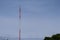 White and Red Big Steel Pole Telecommunication Internet and Wifi Outdoor Installation Normal Sky Background Optional