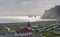 White and red Church overlooking Vik, Iceland