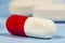 White and red hard gelatin capsule. Generic drugs