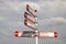 White and red letters signpost sign for cyclists to The Hague and other villages of Zuidplas