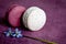 White and red macaroons and spring flower on a linen napkin. Macarons or macaroons is French or Italian dessert