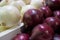 White and red onions on a store counter