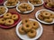 White and red paper plates with five donuts each