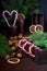 White and red peppermint candy canes in wooden box