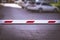 White and Red Security Boom Barrier Gate at the Car Parking Lot for Access Control. Border Control Point. Trade War, Tariffs